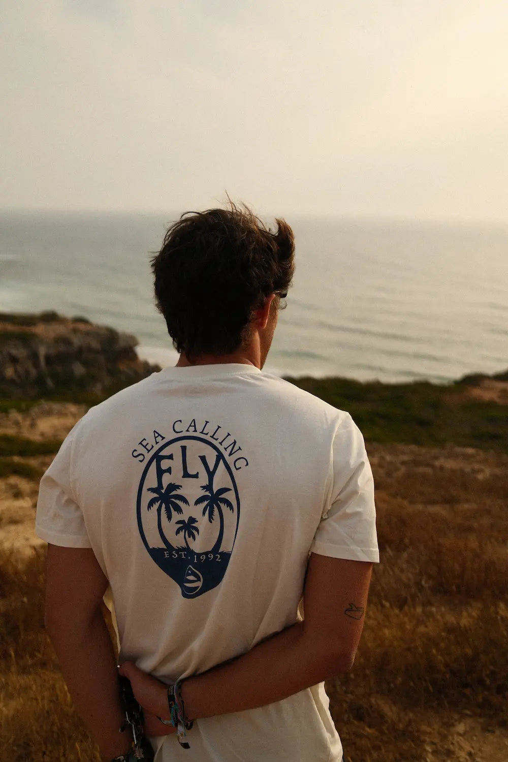 T -shirt chamando creme praia